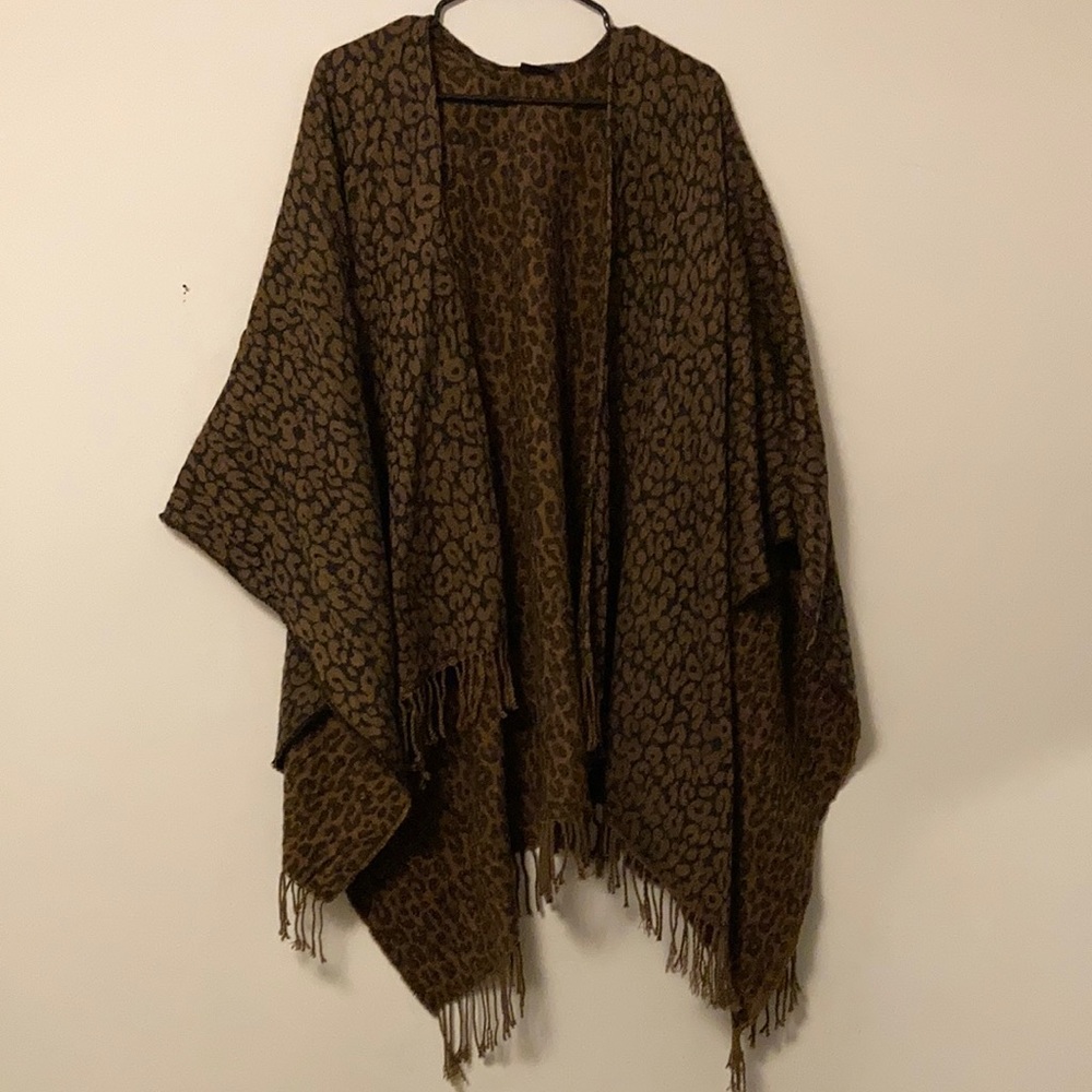Woman’s oversized leopard poncho